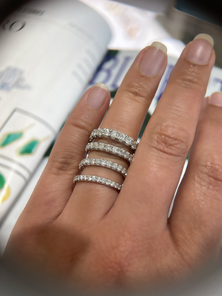 comparing-different-sizes-diamond-wedding-rings-on-a-finger-Fame-Diamonds